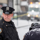 Police officers guard the perimeter of a crime scene where two police officers were shot and wounded Jan. 6, 2015, while responding to a robbery in the Bronx borough of New York City.
Andrew Burton/Getty Images